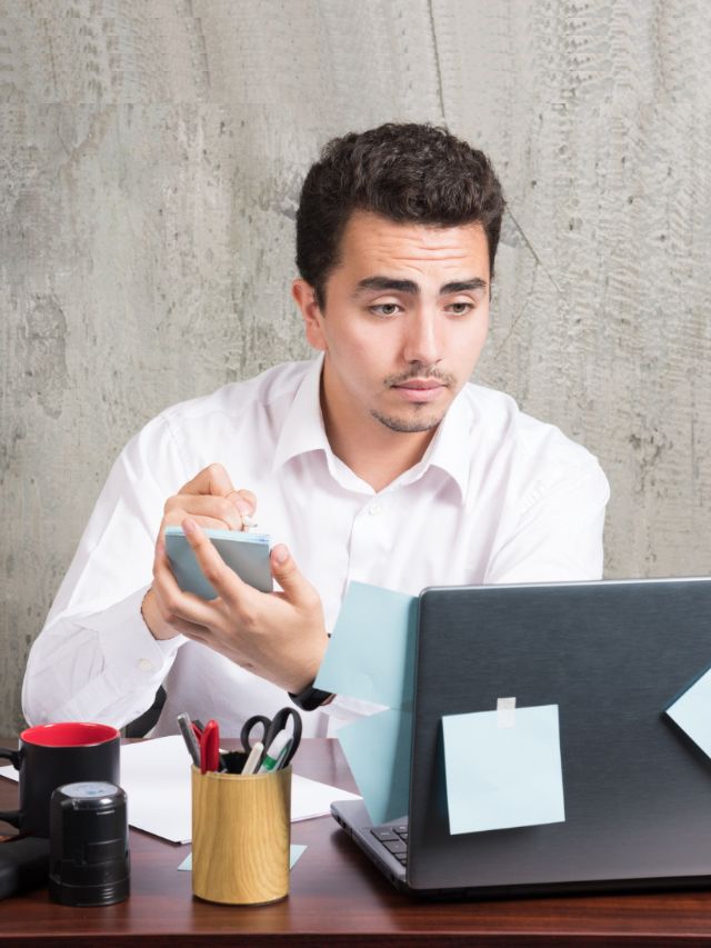 A Man writing notes to avoid financial mistakes