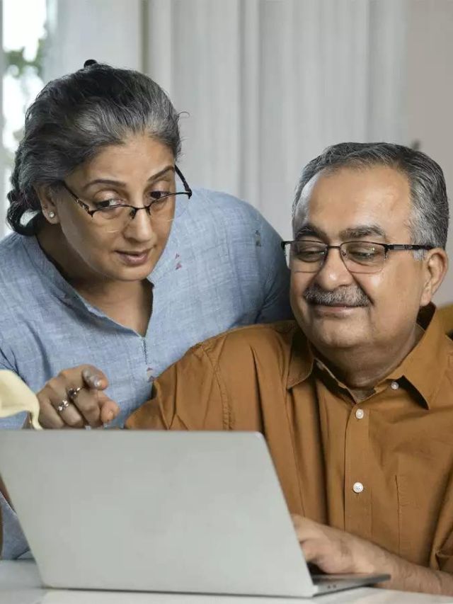 Senior citizens using laptop to fill online jeevan pramaan patra